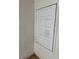 Small door to access storage area with dated door, walls, and flooring at 24047 Ermine Rd, Astor, FL 32102
