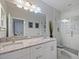Elegant bathroom with a double sink vanity and walk-in glass shower at 302 W Park St, Lakeland, FL 33803