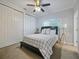Bright bedroom featuring a comfortable bed, fan, and ample closet space at 302 W Park St, Lakeland, FL 33803