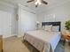 Comfortable bedroom with a full closet, neutral tones, and a view to the backyard at 302 W Park St, Lakeland, FL 33803