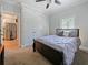 Comfortable bedroom with a ceiling fan, a large window, and light gray walls at 302 W Park St, Lakeland, FL 33803