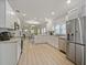 Bright, modern kitchen with stainless steel appliances, white cabinets, and an island counter at 302 W Park St, Lakeland, FL 33803