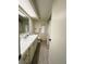Well-lit bathroom with a spacious vanity, mirrored cabinet, and ample storage at 334 Palo Verde Dr, Leesburg, FL 34748