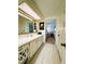 Bright and spacious bathroom with a white vanity area and drawers at 334 Palo Verde Dr, Leesburg, FL 34748