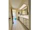 Bright bathroom with white cabinets and drawers and vanity area to get ready in at 334 Palo Verde Dr, Leesburg, FL 34748