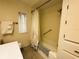 Bright bathroom featuring a bathtub and shower with neutral floral curtains at 334 Palo Verde Dr, Leesburg, FL 34748
