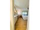Relaxing bedroom with hardwood floor and large vanity provides comfort and convenience at 334 Palo Verde Dr, Leesburg, FL 34748