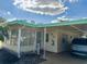 Charming home with covered parking and a cozy screened-in porch area at 334 Palo Verde Dr, Leesburg, FL 34748