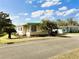 Inviting home with covered parking and a cozy screened-in porch area at 334 Palo Verde Dr, Leesburg, FL 34748