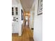 Hallway with wood floors, access to different rooms, and a clean aesthetic at 334 Palo Verde Dr, Leesburg, FL 34748