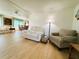 Cozy living room with comfortable seating, wood floors, and an open layout at 334 Palo Verde Dr, Leesburg, FL 34748