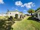 Well-maintained side yard with manicured landscaping and lush green grass at 334 Palo Verde Dr, Leesburg, FL 34748