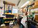 Well-organized storage room with workbench, shelving, and storage containers at 334 Palo Verde Dr, Leesburg, FL 34748
