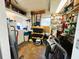 Spacious storage room with a laundry area, shelving, and workbench at 334 Palo Verde Dr, Leesburg, FL 34748