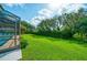 Large backyard with lush lawn and mature landscaping at 365 N Spaulding Cv, Lake Mary, FL 32746
