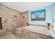 Spacious bathroom features a tiled shower, soaking tub, and ample counter space at 365 N Spaulding Cv, Lake Mary, FL 32746