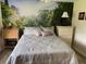 Comfortable bedroom featuring a unique mural, neutral bedding, and classic furnishings at 365 N Spaulding Cv, Lake Mary, FL 32746