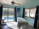 Bright exercise room showcases a pool view with sliding glass doors and modern workout equipment at 365 N Spaulding Cv, Lake Mary, FL 32746