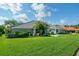 Charming single-story home with a well-manicured lawn and colorful landscaping at 365 N Spaulding Cv, Lake Mary, FL 32746
