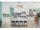 Bright kitchen with a large island, granite countertops, stainless appliances, and plenty of white cabinets at 365 N Spaulding Cv, Lake Mary, FL 32746