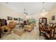 An elegant living room boasts marble floors, unique furnishings, and access to the lanai at 365 N Spaulding Cv, Lake Mary, FL 32746