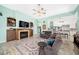 Inviting living room with fireplace, comfortable seating, and open access to the kitchen and dining areas at 365 N Spaulding Cv, Lake Mary, FL 32746