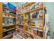 Walk-in pantry with organized shelving and storage for food items and kitchen appliances at 365 N Spaulding Cv, Lake Mary, FL 32746