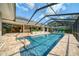 Beautiful backyard pool area with brick pavers and comfortable seating at 365 N Spaulding Cv, Lake Mary, FL 32746