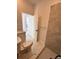 Bathroom showcasing modern fixtures, marble-tiled shower, and access to adjacent spaces at 4420 W Gore Ave, Orlando,, FL 32811