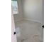 Bright bedroom with marble-patterned tile flooring and a large window at 4420 W Gore Ave, Orlando,, FL 32811