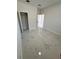 Bedroom with marble-patterned tile flooring and closet with shelf at 4420 W Gore Ave, Orlando,, FL 32811
