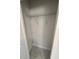 A closet with a wire shelf and marble tile flooring provides organized storage space at 4420 W Gore Ave, Orlando,, FL 32811