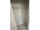 Walk-in closet with shelf and marble-patterned flooring at 4420 W Gore Ave, Orlando,, FL 32811