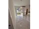 Bright dining area featuring marble floors, modern light fixture, and backyard views at 4420 W Gore Ave, Orlando,, FL 32811