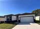 Well maintained single-Gathering home with attached two car garage and a long driveway at 4420 W Gore Ave, Orlando,, FL 32811