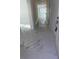 Hallway featuring elegant marble flooring and natural light, guiding you through the home at 4420 W Gore Ave, Orlando,, FL 32811
