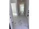 Long hallway with elegant marble flooring and bright lighting, creating an inviting path at 4420 W Gore Ave, Orlando,, FL 32811