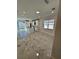 Open concept room featuring marble floors and backyard entrance at 4420 W Gore Ave, Orlando,, FL 32811