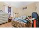 Comfortable bedroom with playful decor, ideal for a , featuring laminate wood flooring at 5526 P G A Blvd # 4911, Orlando, FL 32839