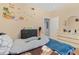 Bright bedroom with a dinosaur theme, featuring laminate flooring and a double bed at 5526 P G A Blvd # 4911, Orlando, FL 32839