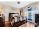 Inviting bedroom with hardwood floors, decorative windows, and plenty of natural light at 5526 P G A Blvd # 4911, Orlando, FL 32839