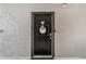 A welcoming condo front door with decorative wreath and secure entry at 5526 P G A Blvd # 4911, Orlando, FL 32839