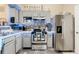 Modern kitchen featuring updated appliances, ample counter space, and sleek cabinets at 5526 P G A Blvd # 4911, Orlando, FL 32839