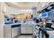 Well-lit kitchen featuring stainless steel appliances, modern cabinets, and stylish backsplash at 5526 P G A Blvd # 4911, Orlando, FL 32839