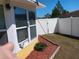 Enclosed backyard featuring a well-maintained fence and landscaping for privacy and charm at 6832 Oswego Dr, Mount Dora, FL 32757