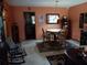 Charming dining room features a round table, wooden chairs, and a decorative rug at 6832 Oswego Dr, Mount Dora, FL 32757