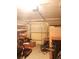 Unorganized garage with boxes, miscellaneous items, and minimal storage at 6832 Oswego Dr, Mount Dora, FL 32757