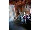 Living room featuring wood walls and two chairs at 6832 Oswego Dr, Mount Dora, FL 32757