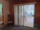 Living room featuring neutral walls and a sliding glass door at 6832 Oswego Dr, Mount Dora, FL 32757