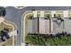 An aerial view shows a well-maintained home with a grey roof surrounded by lush greenery and neighborhood streets at 9324 Pecky Cypress Way, Orlando, FL 32836